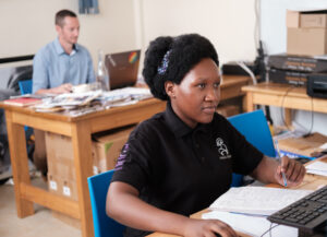Gloria seated at her desk working at Urban Chevre