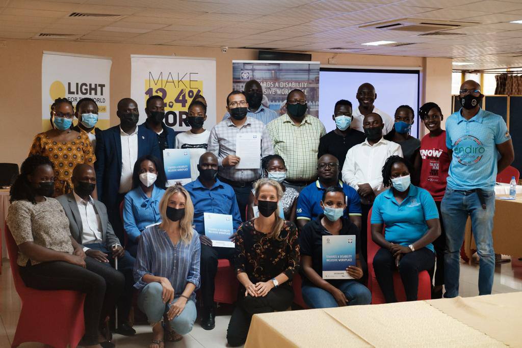 Members of different companies, including Stanbic Bank show their UBDN charter forms they signed after the 2021 Career Fair.