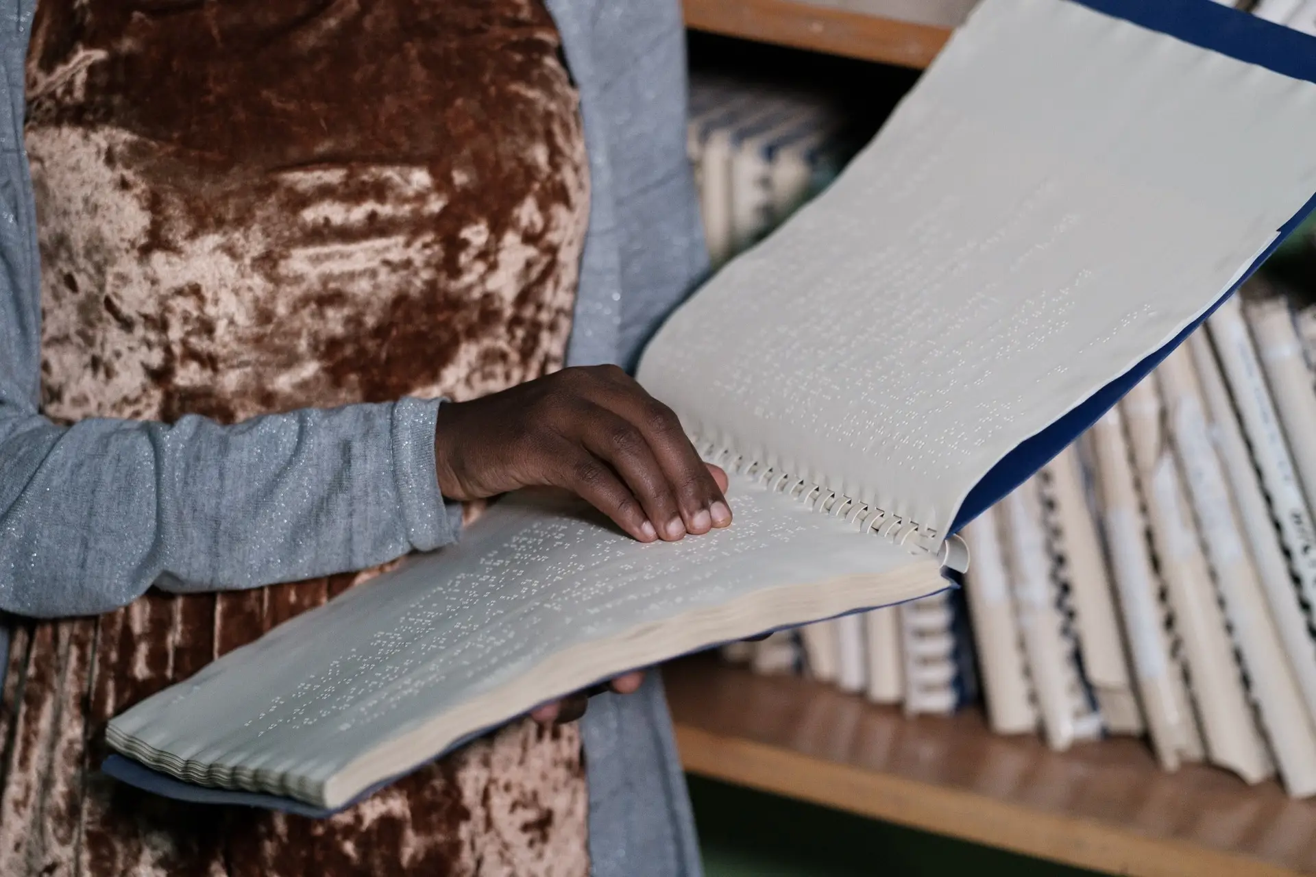 Woman reading braille